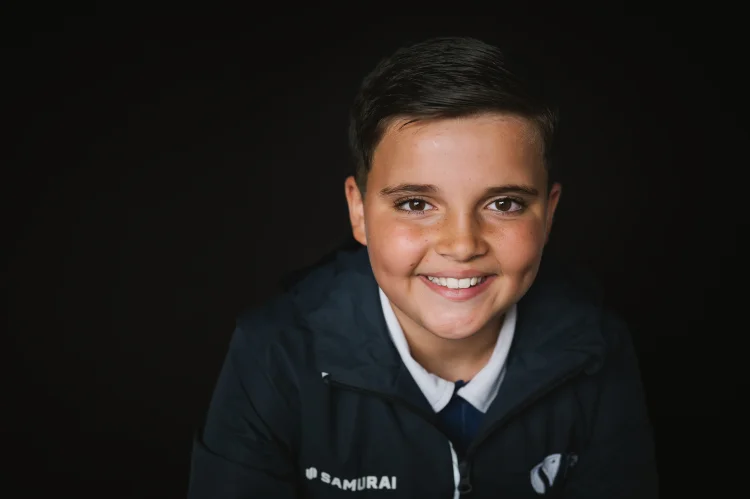 A student in sport kit